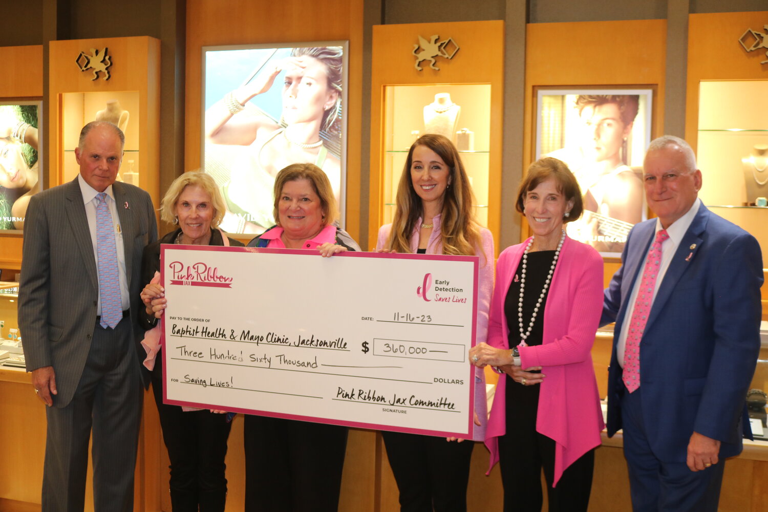 Clayton Bromberg and Christy Bromberg of Underwood Jewelers presented Marica Pendjer and members of Pink Ribbon Jax with a check for $360,000 during an event on Nov. 16.